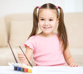 Image showing Cute cheerful child play with paints