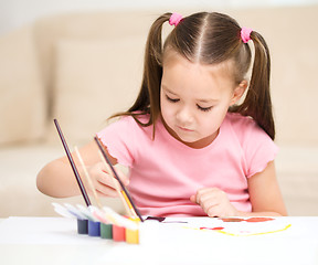 Image showing Cute cheerful child play with paints