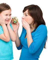 Image showing Little girl and her mother are anxious about time