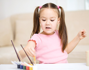 Image showing Cute cheerful child play with paints