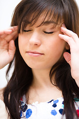 Image showing Woman is suffering headache