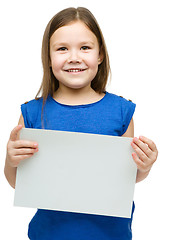 Image showing Little girl is holding blank banner