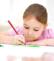 Image showing Cute cheerful child drawing using felt-tip pen