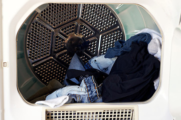 Image showing Open dryer with laundry