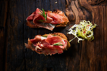 Image showing Two slice of Spanish tapas with jamon