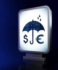Image showing Safety concept: Money And Umbrella on billboard background