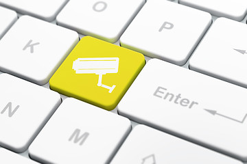 Image showing Protection concept: Cctv Camera on computer keyboard background