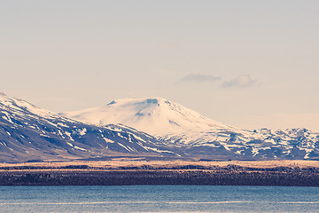Image showing Snow on mountains by the sea