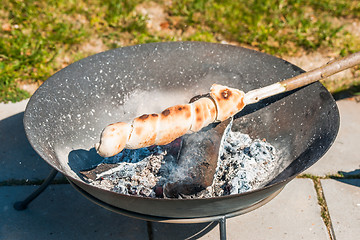 Image showing Bonfire in a garden with grilled bread
