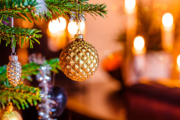 Image showing Christmas tree with a golden bauble