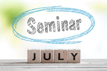 Image showing July seminar message on a stage