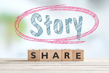 Image showing Share story sign on a table