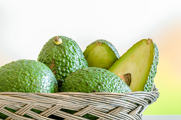 Image showing Avocado stacked in a basket