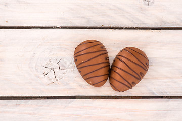 Image showing Chocolate eggs on a wooden table