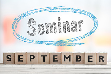 Image showing September seminar sign with blue sketch
