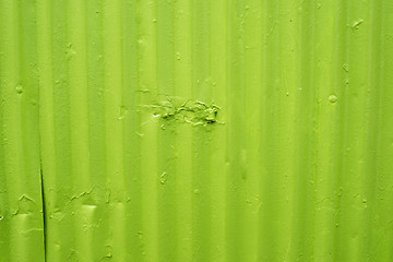 Image showing Green metal surface with worn paint