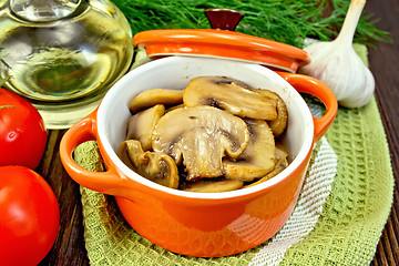 Image showing Champignons fried in roaster on board