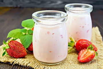 Image showing Yogurt with strawberries on sacking