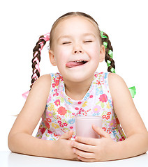 Image showing Cute little girl with a glass of milk