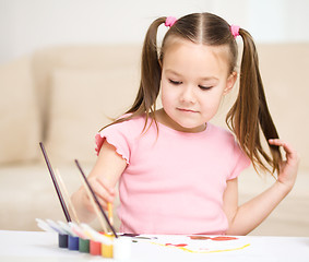 Image showing Cute cheerful child play with paints