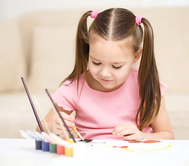 Image showing Cute cheerful child play with paints