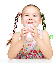 Image showing Cute little girl showing milk moustache