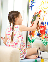 Image showing Portrait of a cute girl playing with paints