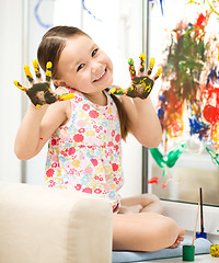 Image showing Portrait of a cute girl playing with paints