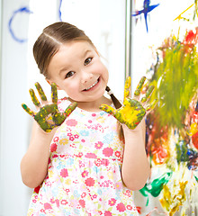 Image showing Portrait of a cute girl playing with paints