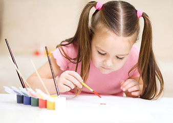 Image showing Cute cheerful child play with paints