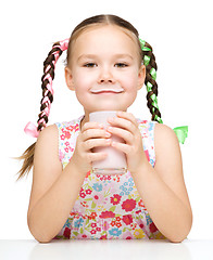 Image showing Cute little girl showing milk moustache