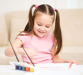 Image showing Cute cheerful child play with paints