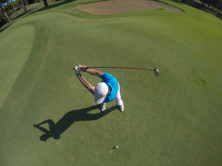 Image showing top view of golf player hitting shot