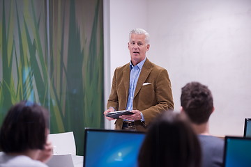 Image showing teacher and students in computer lab classroom