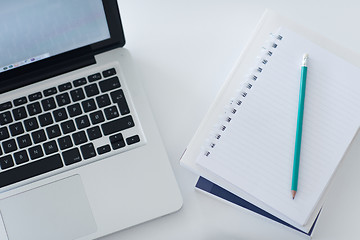 Image showing flat lay of laptop and notepad