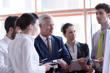 Image showing young startup businessman making presentation to senior investio