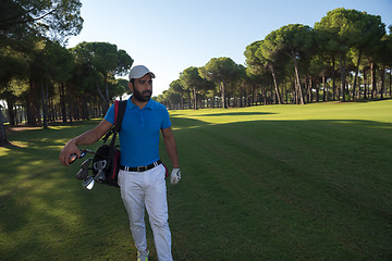 Image showing golf player walking