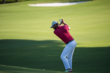 Image showing golf player hitting long shot