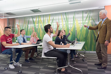 Image showing teacher with a group of students in classroom