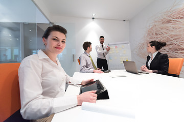 Image showing business people group brainstorming and taking notes to flip boa