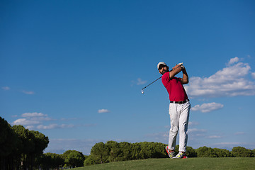 Image showing golf player hitting long shot