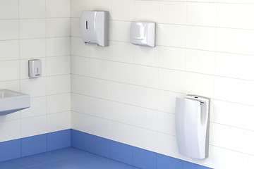 Image showing Three different types of hand dryers in the toilet