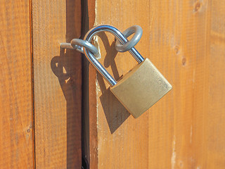 Image showing Padlock on a wood door