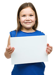 Image showing Little girl is holding blank banner