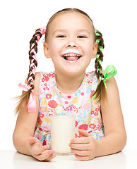 Image showing Cute little girl showing milk moustache