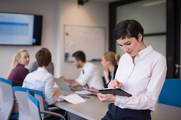 Image showing business woman on meeting  using tablet