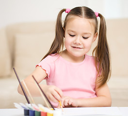 Image showing Cute cheerful child play with paints