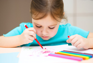 Image showing Cute cheerful child drawing using felt-tip pen