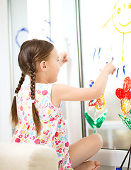 Image showing Portrait of a cute girl playing with paints