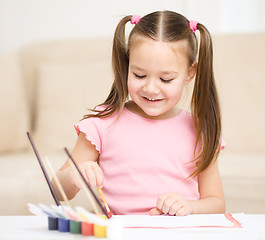 Image showing Cute cheerful child play with paints